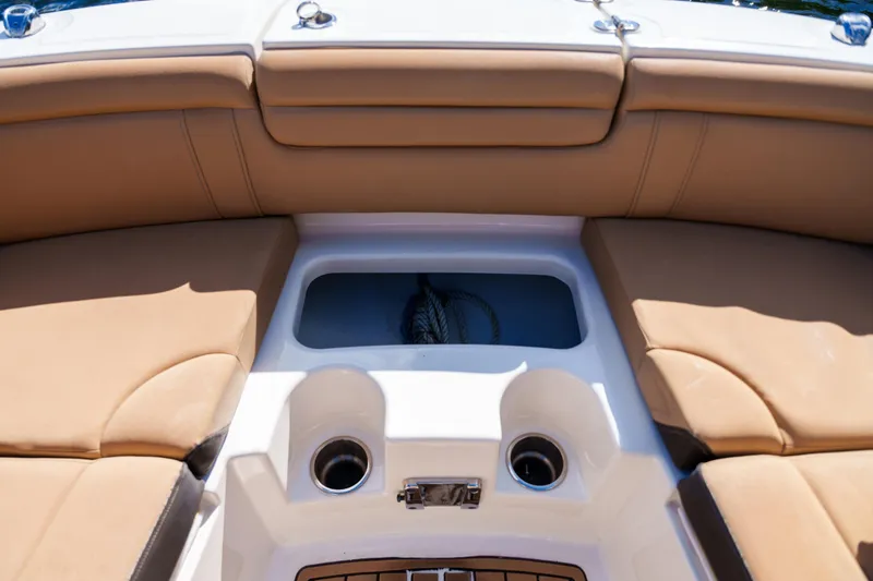 Slide: The Image of Interior view of a Sea Ray boat with tan seating and cup holders. - 33