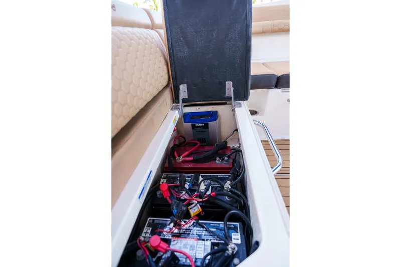 Slide: The Image of Sea Ray boat battery compartment with multiple batteries and wiring. - 49