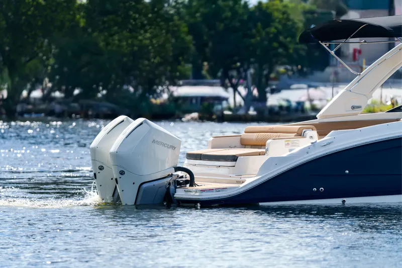 Slide: The Image of Sea Ray boat with Mercury outboard engines on a calm lake. - 7