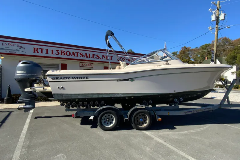 The Image of 2014 Grady-White Freedom 225 boat on trailer at dealership. - 1