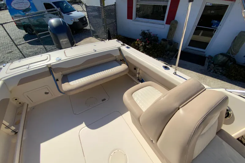 Slide: The Image of 2014 Grady-White Freedom 225 boat interior with seating and motor view. - 15
