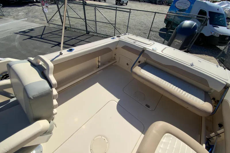 Slide: The Image of 2014 Grady-White Freedom 225 boat interior with seating and storage compartments. - 16