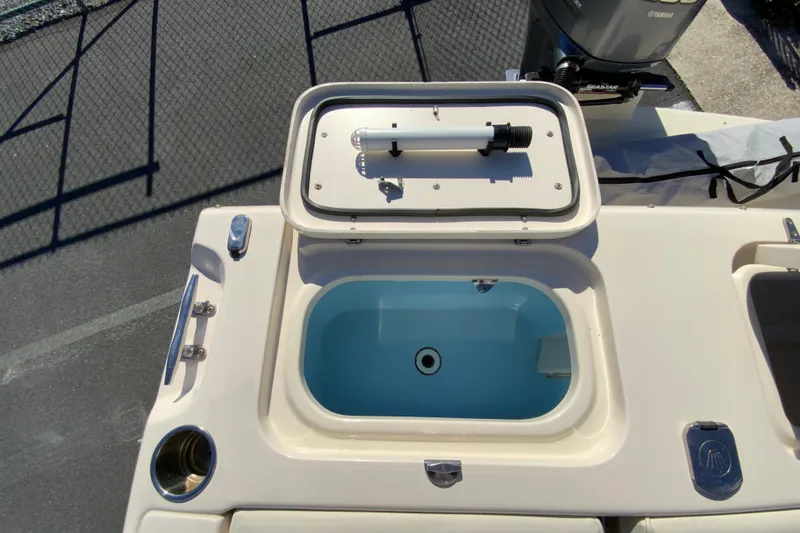Slide: The Image of 2014 Grady-White Freedom 225 boat with open livewell and Yamaha engine. - 19