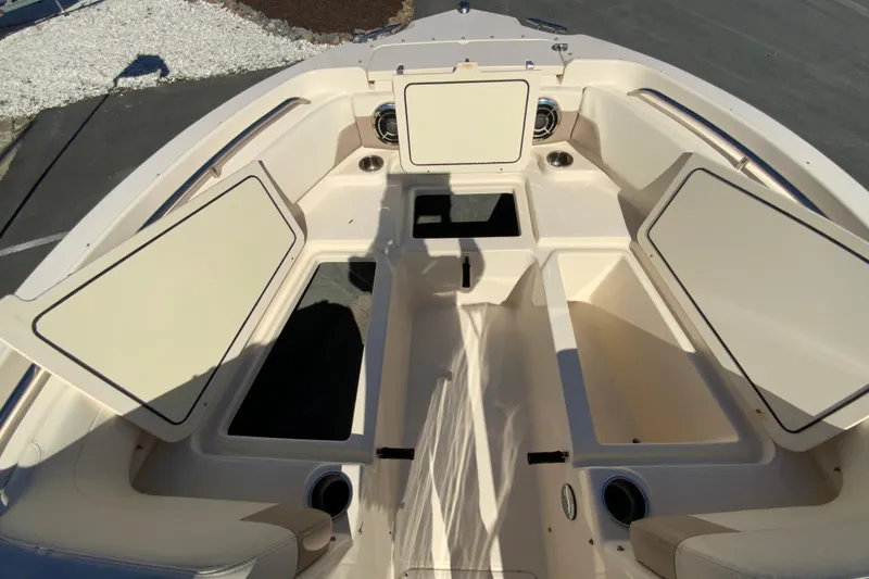 Slide: The Image of 2014 Grady-White Freedom 225 boat interior with open storage compartments. - 22