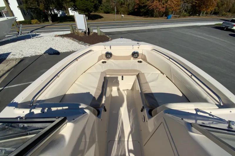 Slide: The Image of 2014 Grady-White Freedom 225 boat interior with seating and speakers. - 24