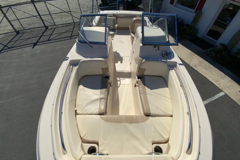 Slide: The Image of 2014 Grady-White Freedom 225 boat interior with seating and windshield. - 25