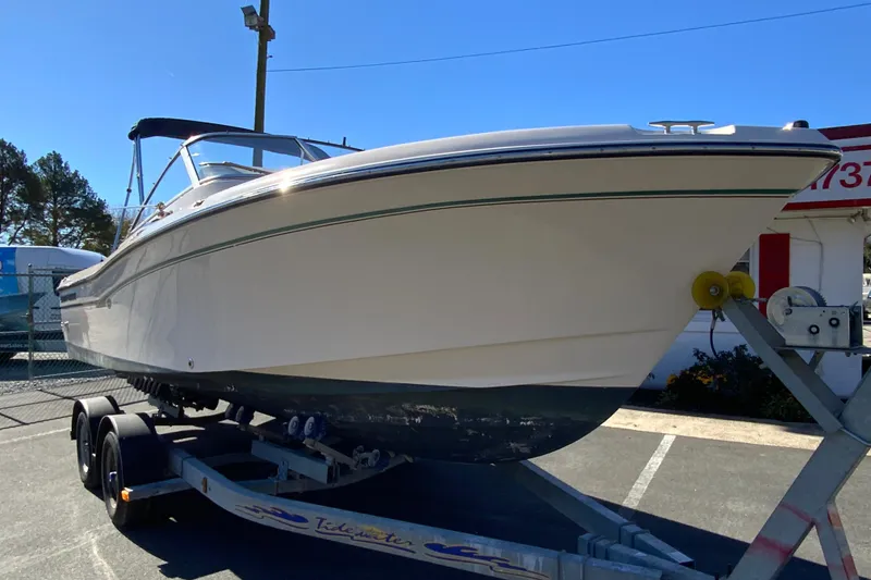 Slide: The Image of 2014 Grady-White Freedom 225 boat on trailer, parked outdoors. - 3