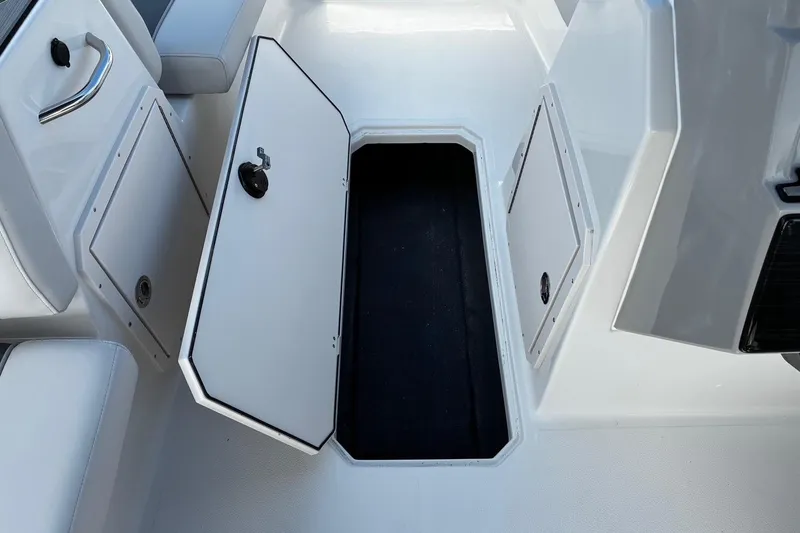 Slide: The Image of 2026 Starcraft SVX 191 OB boat storage compartment with open hatch. - 10