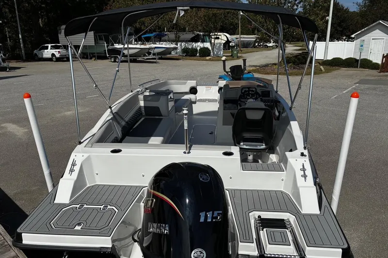 Slide: The Image of 2026 Starcraft SVX 191 OB boat with Yamaha 115 engine, featuring spacious deck and canopy. - 4