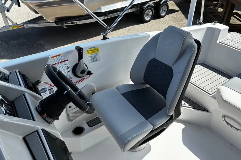 Slide: The Image of Captain's seat and controls of 2026 Starcraft SVX 191 OB boat. - 7