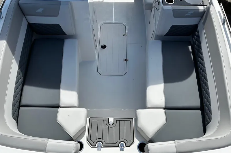 Slide: The Image of Interior seating of 2026 Starcraft SVX 191 OB boat, featuring gray and white upholstery. - 13