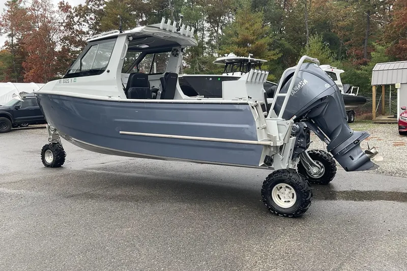Slide: The Image of 2023 Sealegs 8.5 Alloy Cabin boat with wheels, parked outdoors. - 11