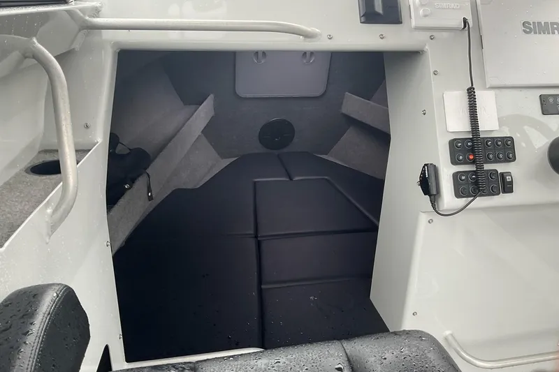 Slide: The Image of Interior of 2023 Sealegs 8.5 Alloy Cabin boat, featuring control panel and seating area. - 12