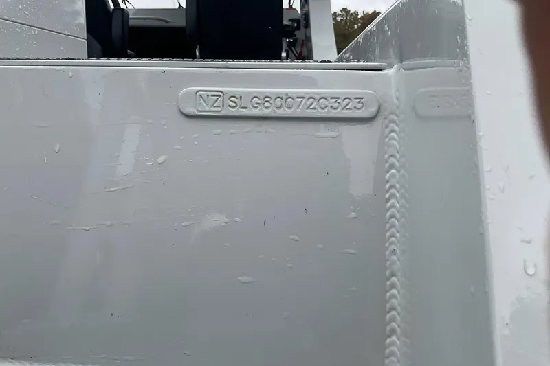 Slide: The Image of 2023 Sealegs 8.5 Alloy Cabin boat with visible serial number on wet surface. - 4