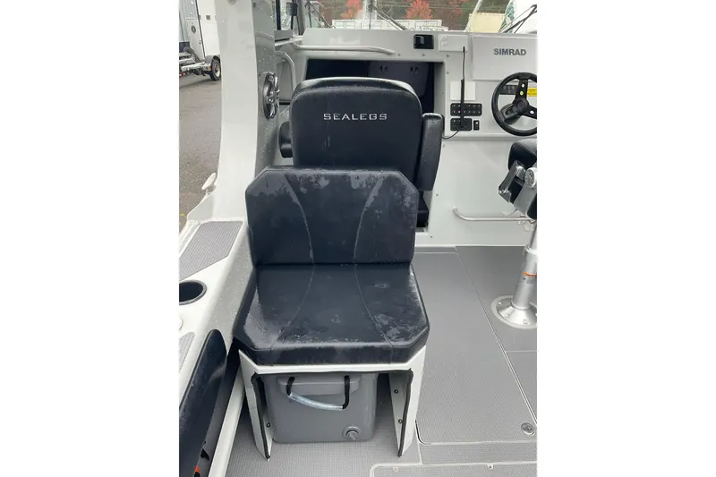 Slide: The Image of 2023 Sealegs 8.5 Alloy Cabin interior with black seat and control panel. - 6