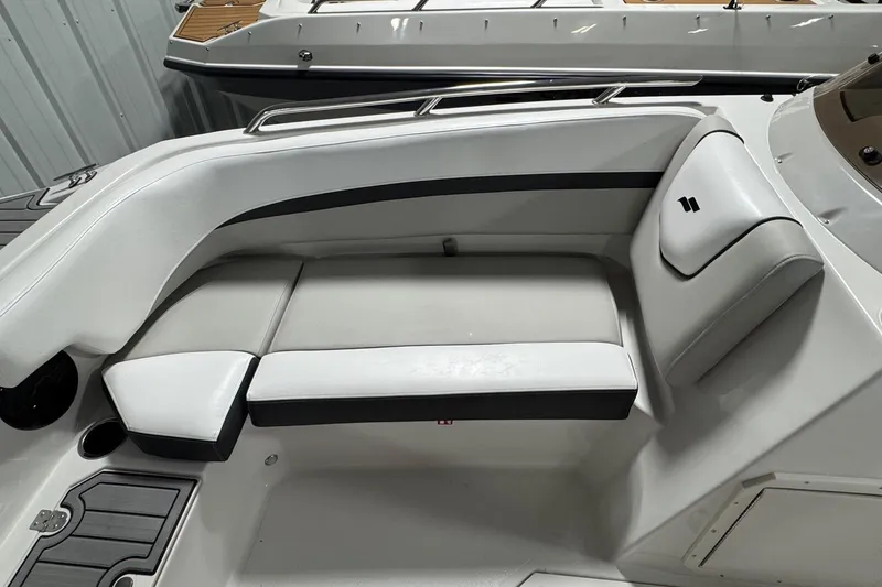 Slide: The Image of 2026 Starcraft SVX 191 OB boat interior with white cushioned seating and sleek design. - 14