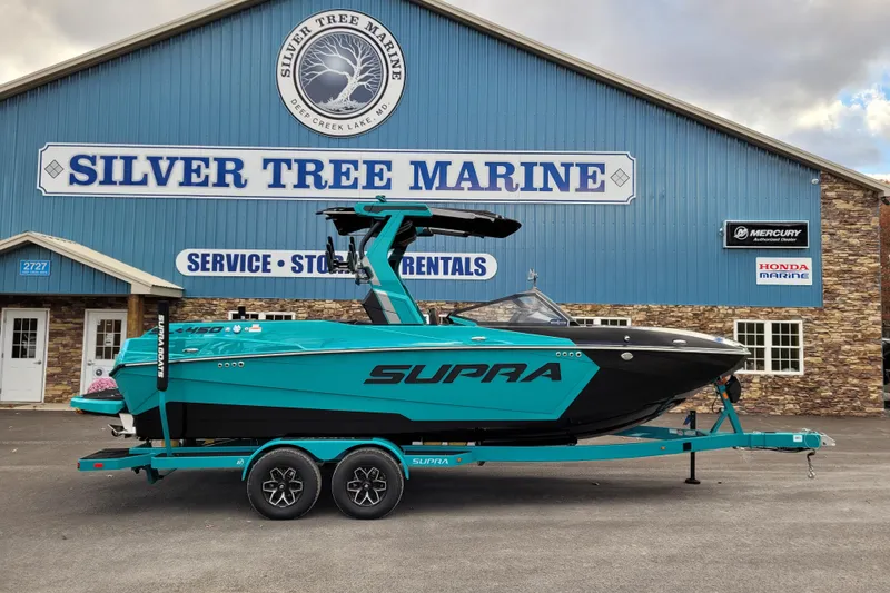 The Image of 2026 Supra SL boat in teal and black at Silver Tree Marine dealership. - 0