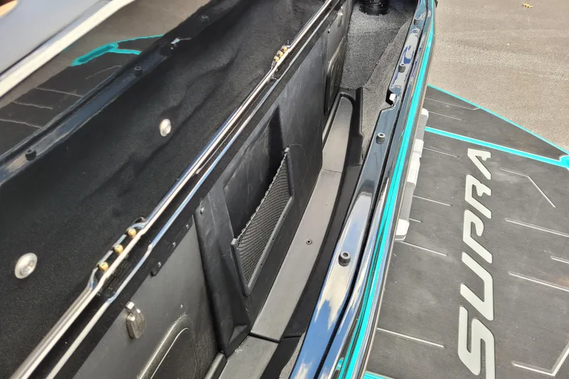 Slide: The Image of 2026 Supra SL trunk interior with sleek design and modern features. - 14