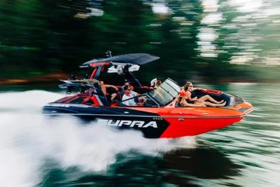 Slide: The Image of Manufacturer Provided Image: 2026 Supra SL boat speeding on water with passengers enjoying the ride. - 16