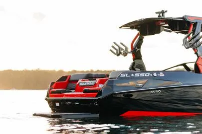 Slide: The Image of Manufacturer Provided Image: 2026 Supra SL boat on water at sunset, featuring sleek design and modern features. - 17