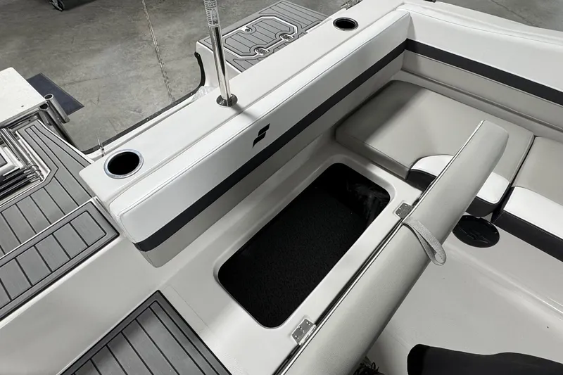 Slide: The Image of Interior of 2026 Starcraft SVX 191 OB boat, featuring seating and storage compartment. - 18
