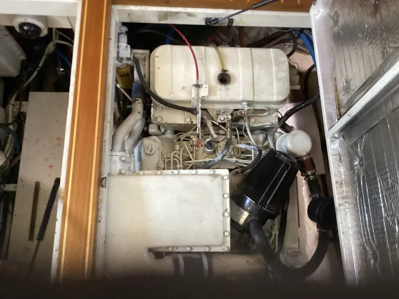 Slide: The Image of Engine compartment of a 1991 MDI Sedan Flybridge, showcasing mechanical components and wiring. - 29