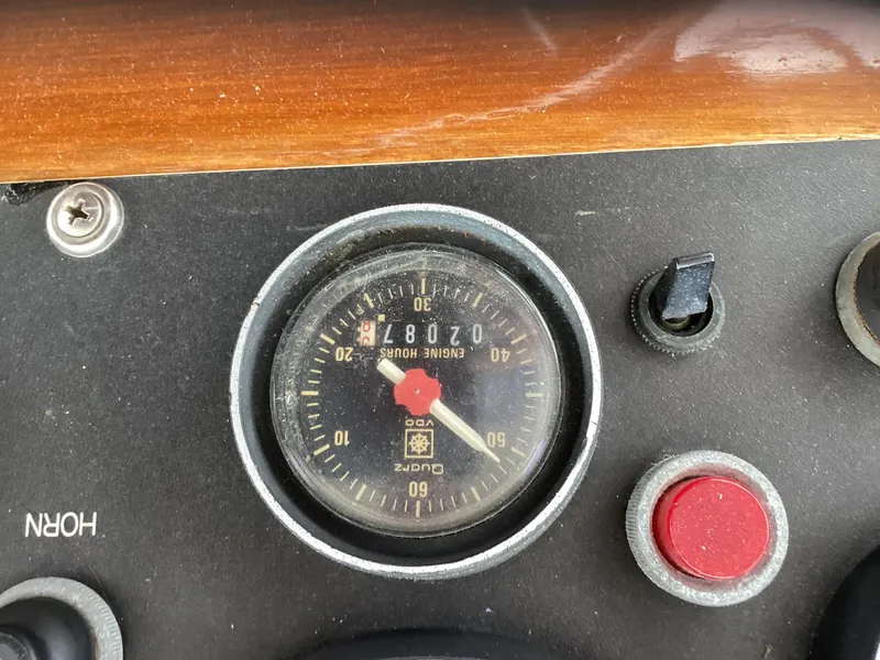 Slide: The Image of Close-up of a 1991 MDI Sedan Flybridge dashboard with engine hour meter. - 37