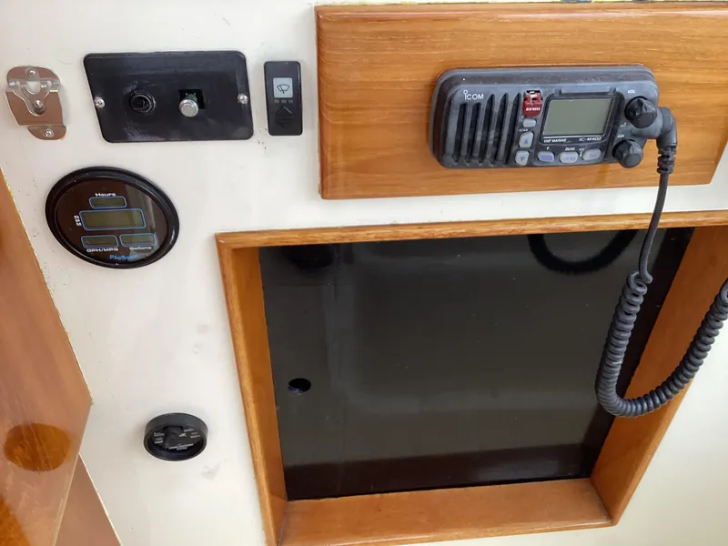 Slide: The Image of Control panel of a 1991 MDI Sedan Flybridge with radio and gauges. - 38