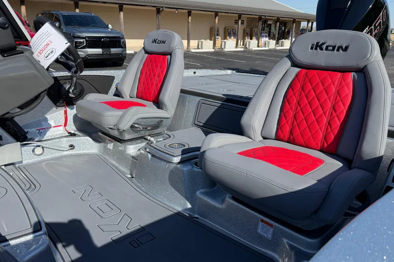Slide: The Image of Interior of 2026 iKon LXE21 boat with red and gray seats, steering wheel visible. - 13