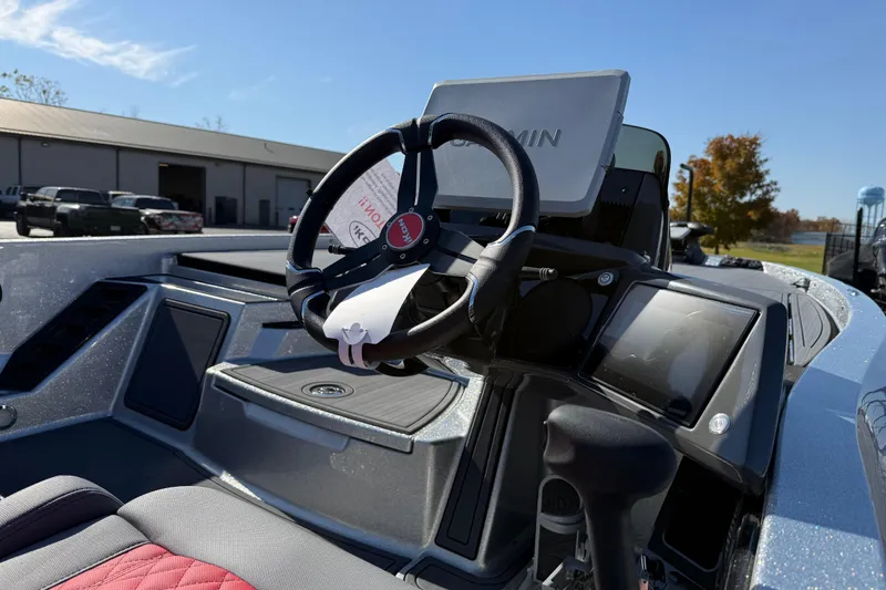 Slide: The Image of 2026 iKon LXE21 boat dashboard with Garmin navigation system and steering wheel. - 7