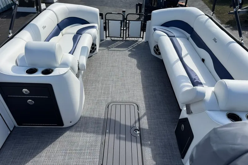 Slide: The Image of Luxurious interior of 2026 JC 23 Neptoon TT Sport pontoon boat with plush seating. - 13