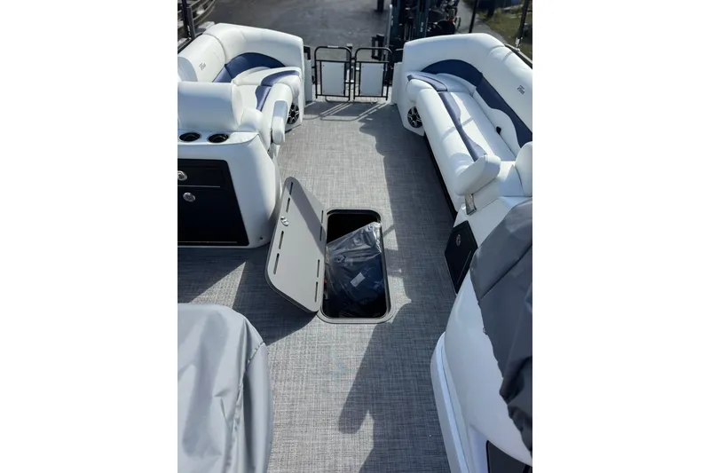 Slide: The Image of 2026 JC 23 Neptoon TT Sport boat interior with open storage compartment and seating. - 14