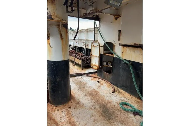 Slide: The Image of Interior of a 1976 Halter Custom Built Mid-Water Trawler, showing ropes and equipment. - 13
