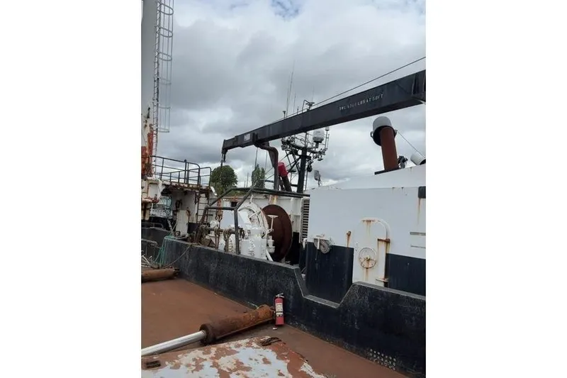 Slide: The Image of 1976 Halter Custom Built Mid-Water Trawler deck with equipment and crane. - 16