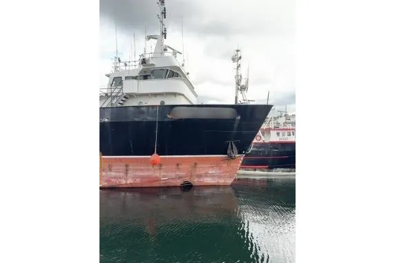 Slide: The Image of 1976 Halter Custom Built Mid-Water Trawler docked, showcasing its robust design and structure. - 4