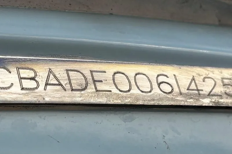 Slide: The Image of Hull identification number on a 2025 Cobia 240 Dual Console boat. - 21