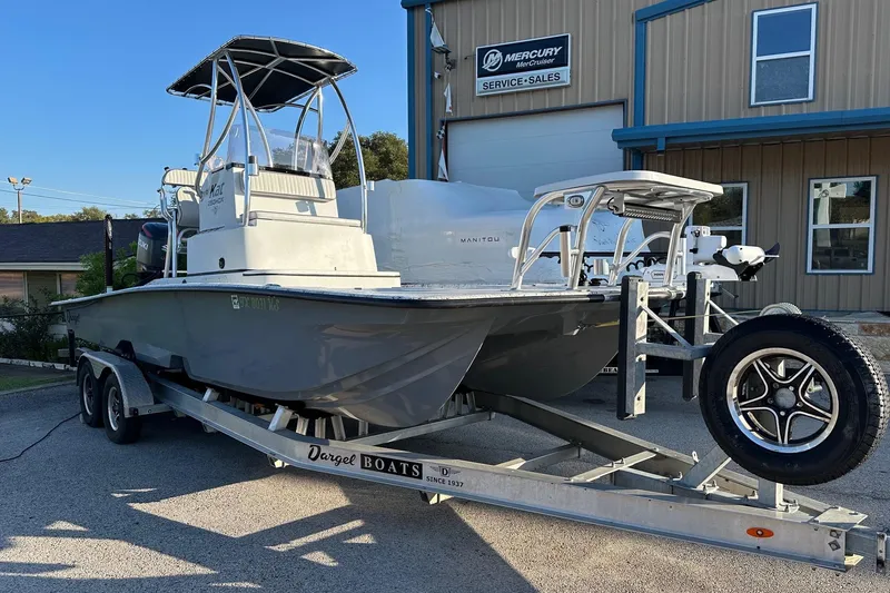 The Image of 2022 Dargel KAT 250DLX boat on trailer outside Mercury service center. - 0