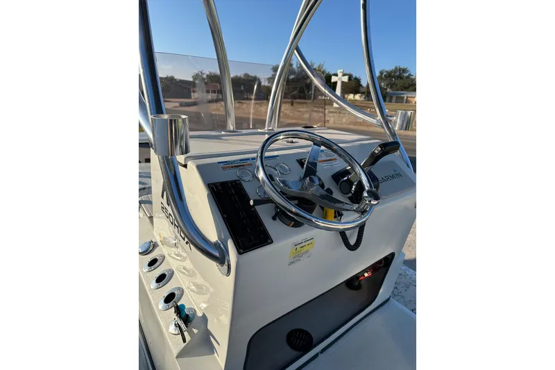 Slide: The Image of 2022 Dargel KAT 250DLX boat console with steering wheel and controls. - 3