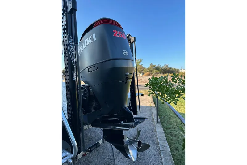 Slide: The Image of 2022 Dargel KAT 250DLX with Suzuki 250 outboard motor, parked outdoors. - 5