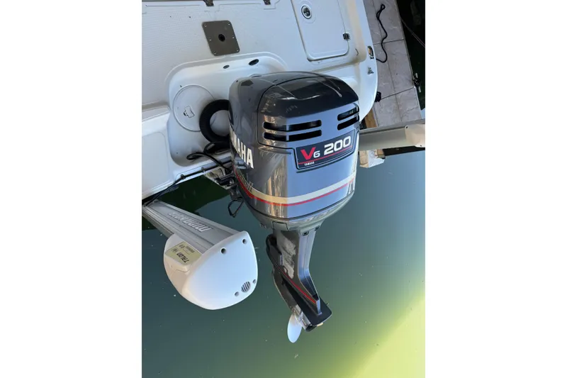 Slide: The Image of Triton 220 LTS 2003 boat with Yamaha V6 200 outboard motor. - 7