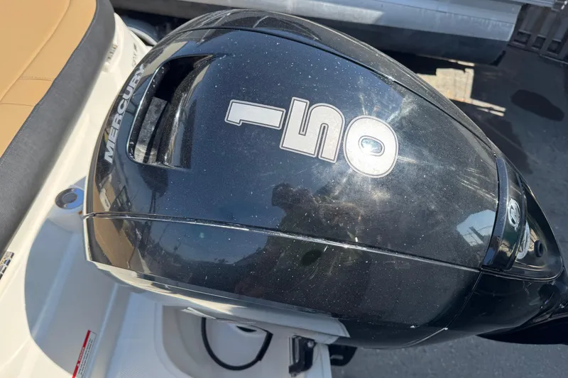 Slide: The Image of 2023 Sea Ray SPX 190 Outboard with Mercury 150 engine, close-up view. - 13