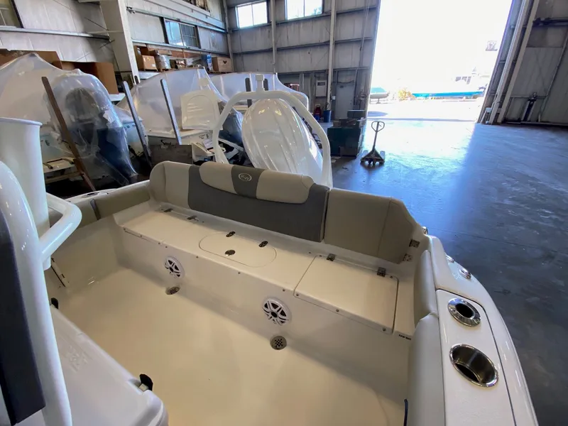 Slide: The Image of 2026 Key West 219 FS boat interior in a warehouse setting. - 11