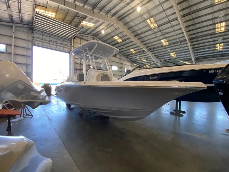 Slide: The Image of 2026 Key West 219 FS boat in a spacious indoor showroom. - 3