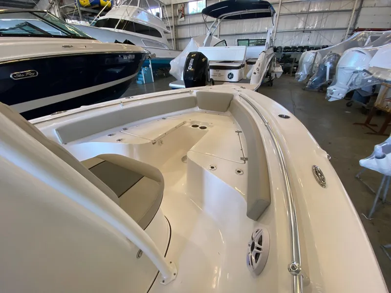 Slide: The Image of 2026 Key West 219 FS boat interior with seating, in a showroom. - 9