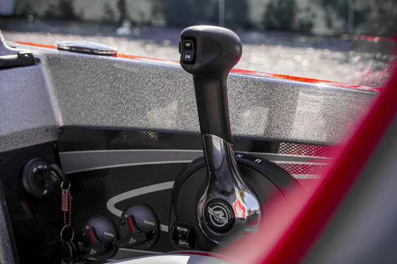 Slide: The Image of 2024 Triton 20XP boat throttle control, featuring sleek design and modern controls. - 14