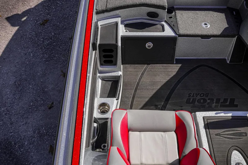 Slide: The Image of 2024 Triton 20XP boat interior with red accents and storage compartments. - 17