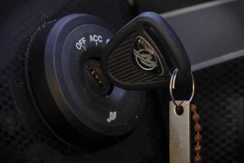 Slide: The Image of 2024 Triton 20XP ignition with key inserted, close-up view. - 20