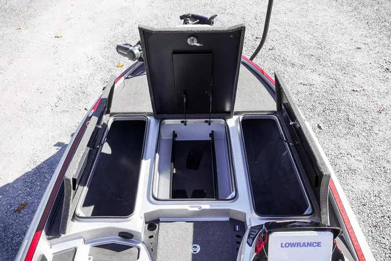 Slide: The Image of 2024 Triton 20XP boat deck with open storage compartments and Lowrance equipment. - 23