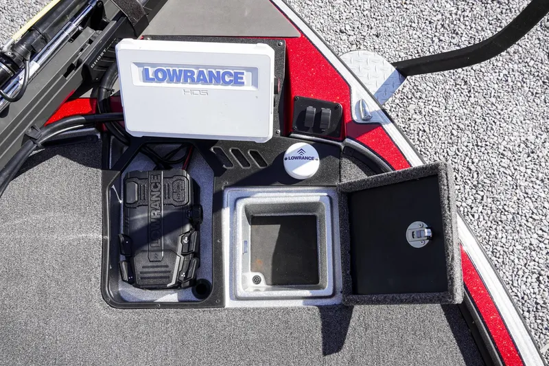 Slide: The Image of 2024 Triton 20XP boat dashboard with Lowrance electronics and storage compartments. - 27