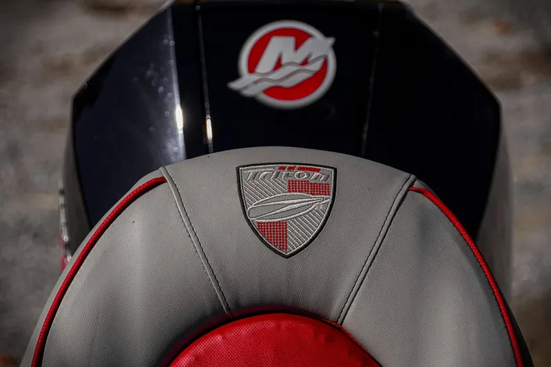 Slide: The Image of 2024 Triton 20XP seat with logo, featuring red and gray design elements. - 34